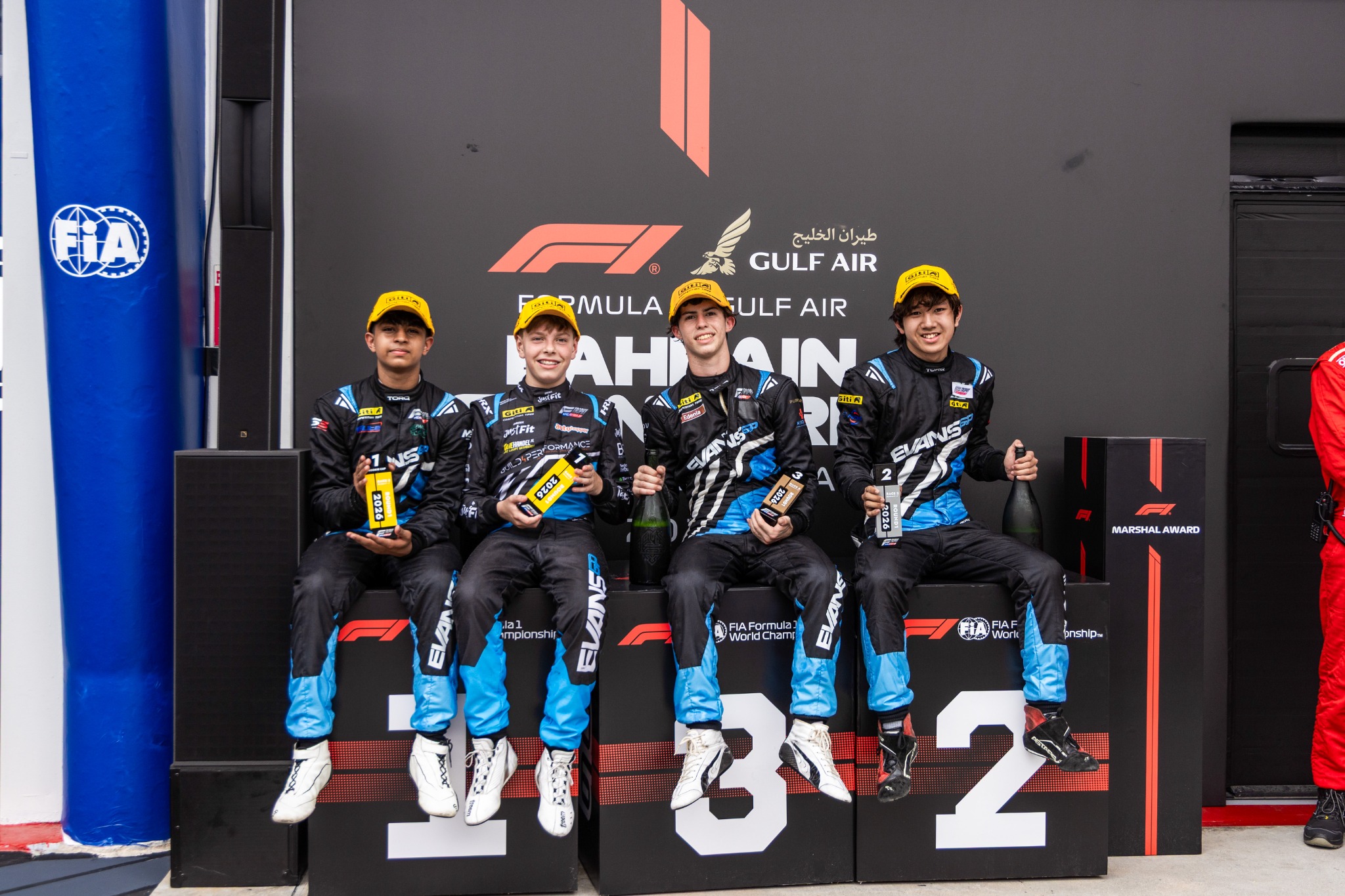 Evans GP drivers together on the Sepang podium